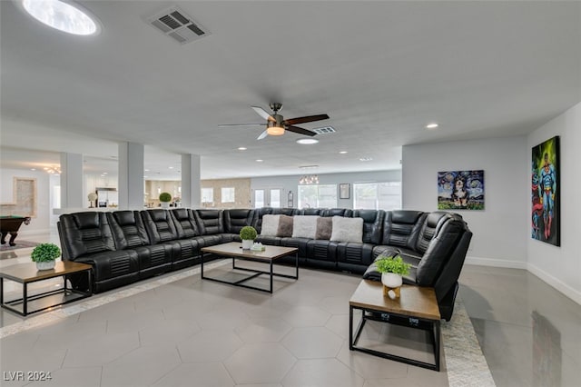 tiled living room with ceiling fan and pool table