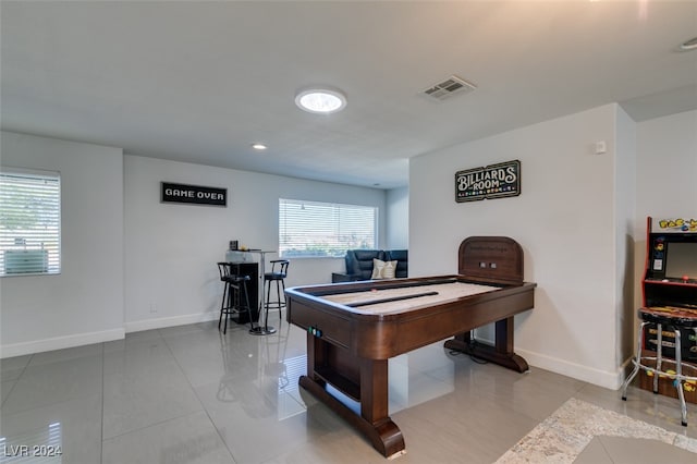 rec room with light tile patterned floors