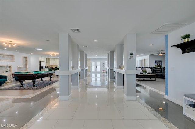 interior space with french doors and light tile patterned floors