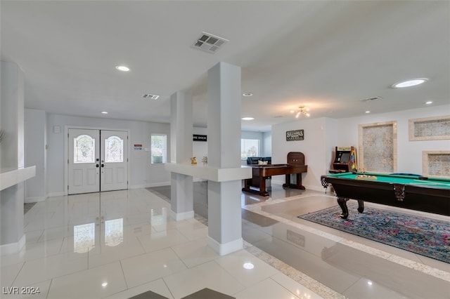 foyer with pool table, french doors, and light tile patterned flooring