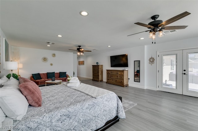 bedroom featuring french doors, access to outside, light hardwood / wood-style flooring, and ceiling fan