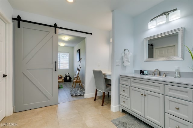 bathroom with hardwood / wood-style floors and vanity