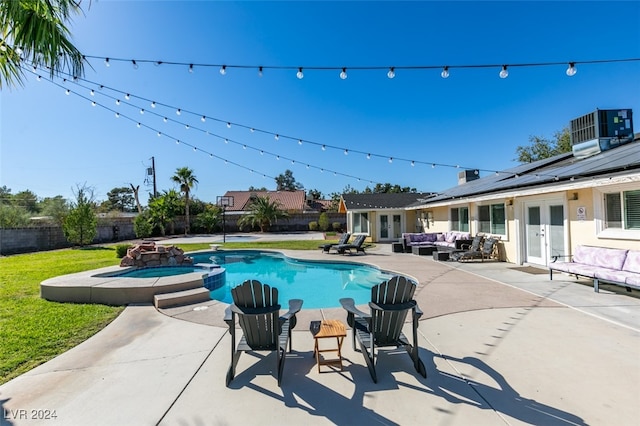 view of swimming pool with a patio, central AC, french doors, and an in ground hot tub