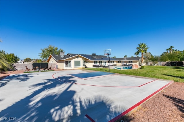 ranch-style house featuring a swimming pool and a front lawn