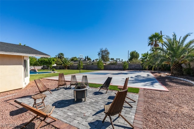 view of patio featuring a fire pit and a pool