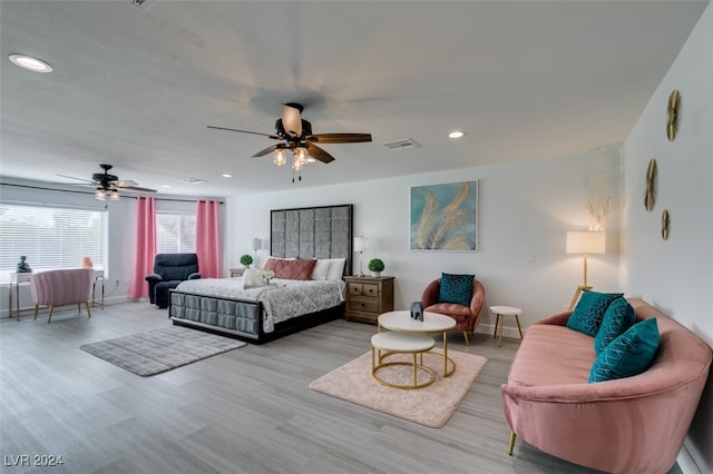 bedroom featuring ceiling fan and light hardwood / wood-style flooring