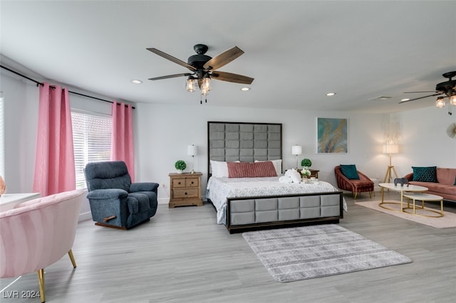 bedroom featuring light wood-type flooring and ceiling fan