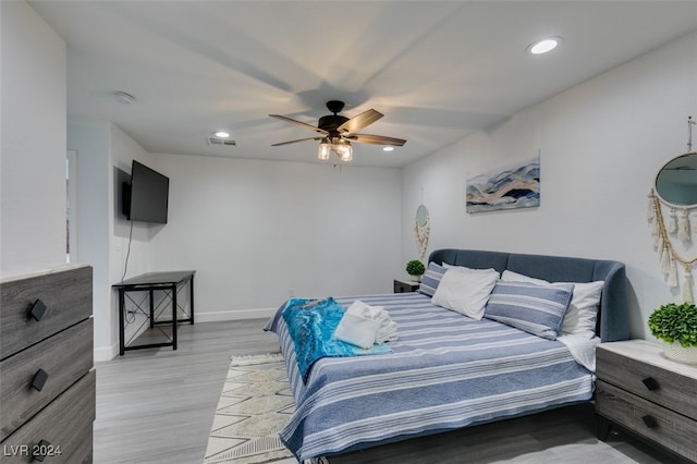 bedroom featuring light hardwood / wood-style floors and ceiling fan