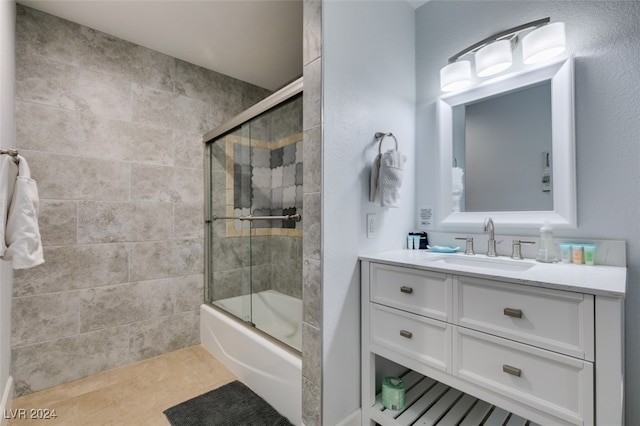 bathroom with shower / bath combination with glass door, vanity, and tile patterned floors