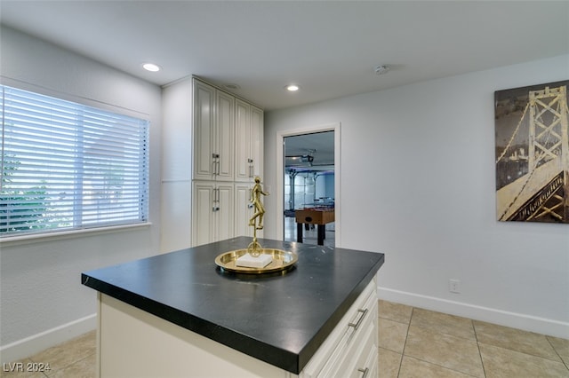 kitchen featuring light tile patterned floors and a center island