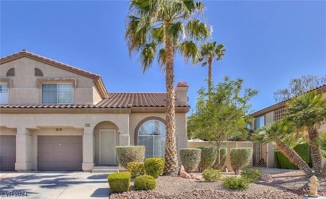 mediterranean / spanish-style house featuring a garage