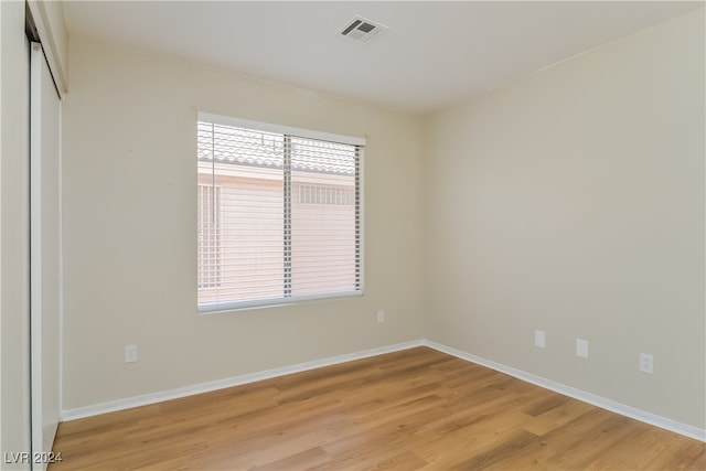 spare room with light hardwood / wood-style flooring