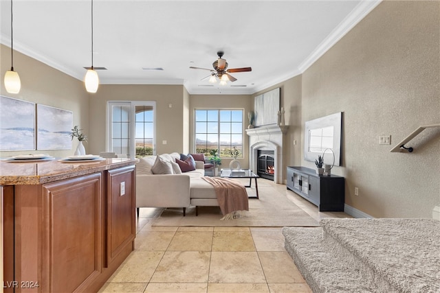 living room featuring light tile patterned floors, ceiling fan, and crown molding