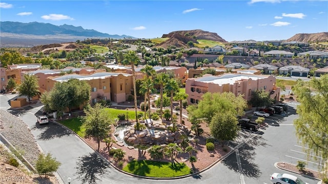 birds eye view of property with a mountain view