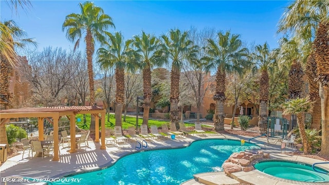 view of pool featuring a hot tub and a patio