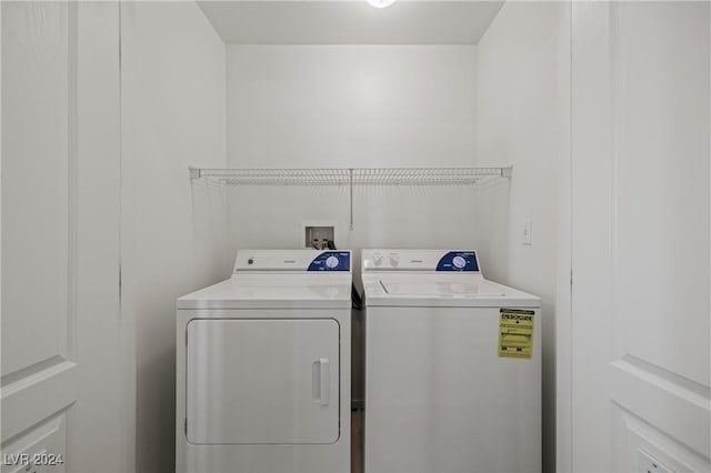 laundry area with independent washer and dryer