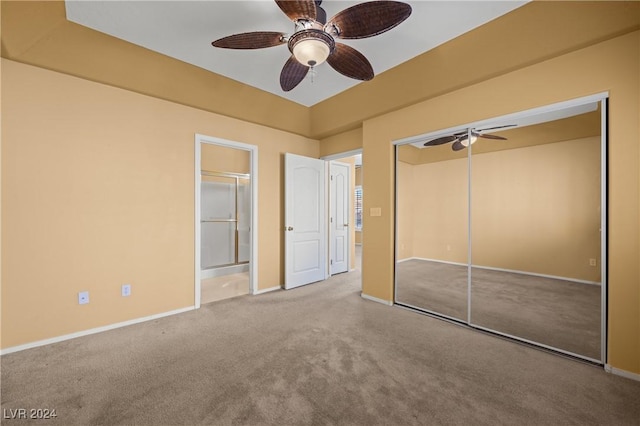 unfurnished bedroom featuring ceiling fan, a closet, connected bathroom, and carpet