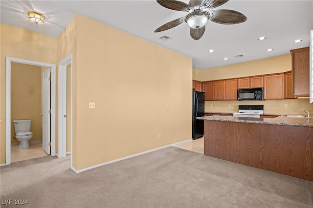 kitchen featuring light colored carpet, kitchen peninsula, light stone countertops, and black appliances