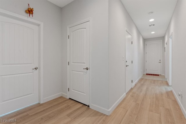 corridor with light wood-type flooring