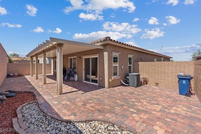 back of house featuring cooling unit and a patio