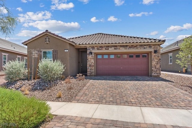 mediterranean / spanish-style house featuring a garage