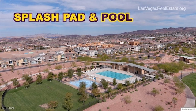 birds eye view of property featuring a mountain view