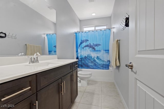 full bathroom featuring tile patterned floors, vanity, shower / bath combination with curtain, and toilet