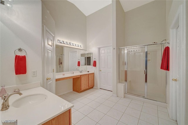 bathroom featuring tile patterned floors, vanity, an enclosed shower, and vaulted ceiling