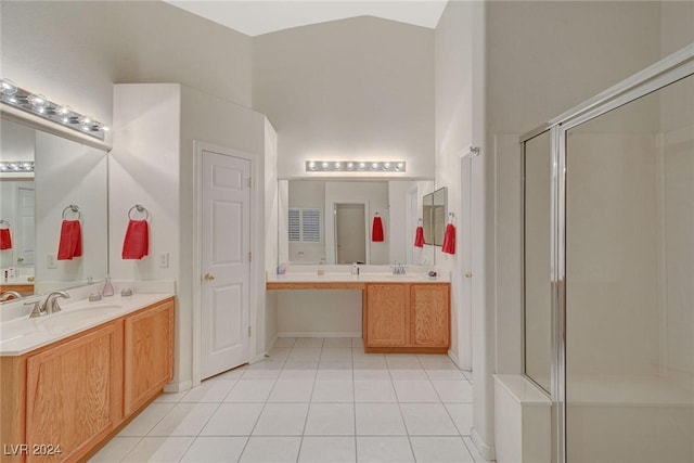 bathroom with tile patterned flooring, vanity, and a shower with shower door