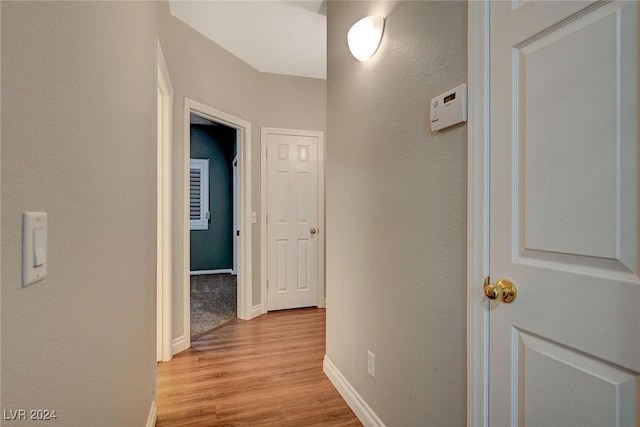 hall with light hardwood / wood-style flooring