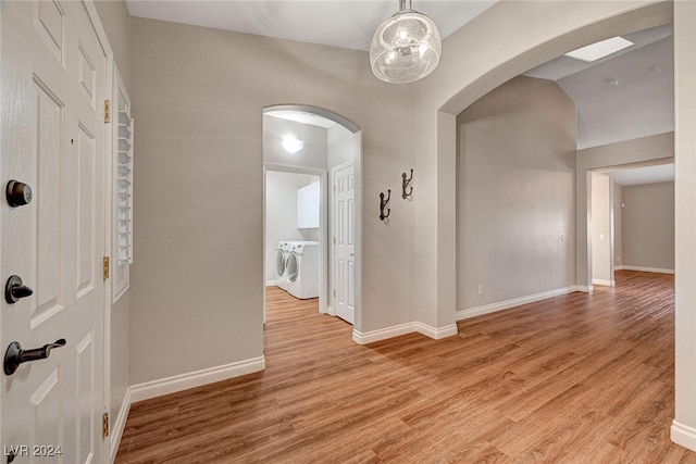 interior space with light hardwood / wood-style floors and independent washer and dryer