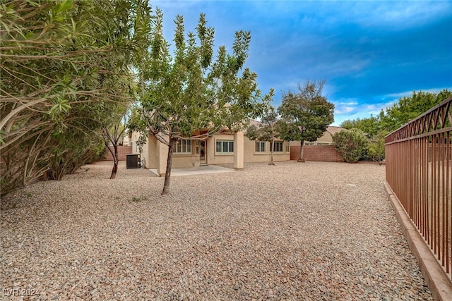 view of yard featuring a patio area and central AC