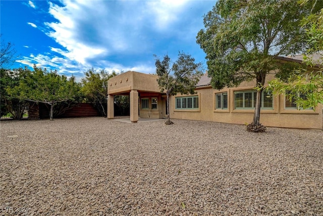 rear view of property with a patio area