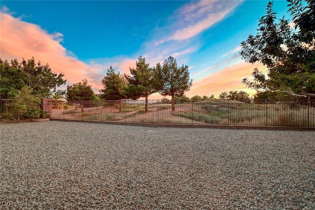 view of yard at dusk