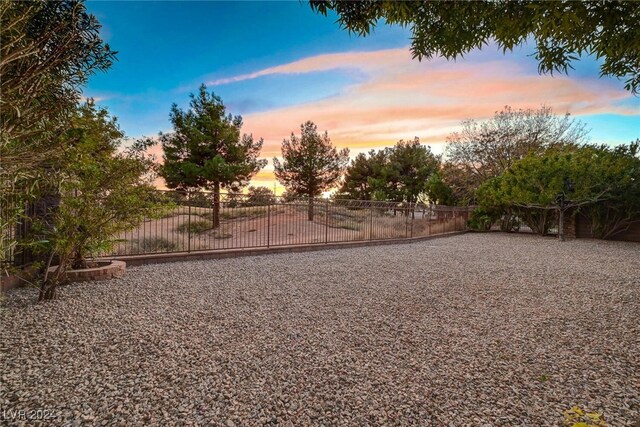 view of yard at dusk