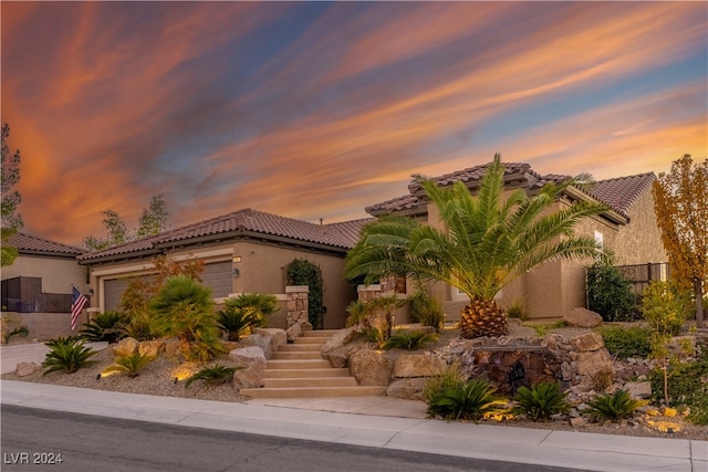 view of front of property with a garage