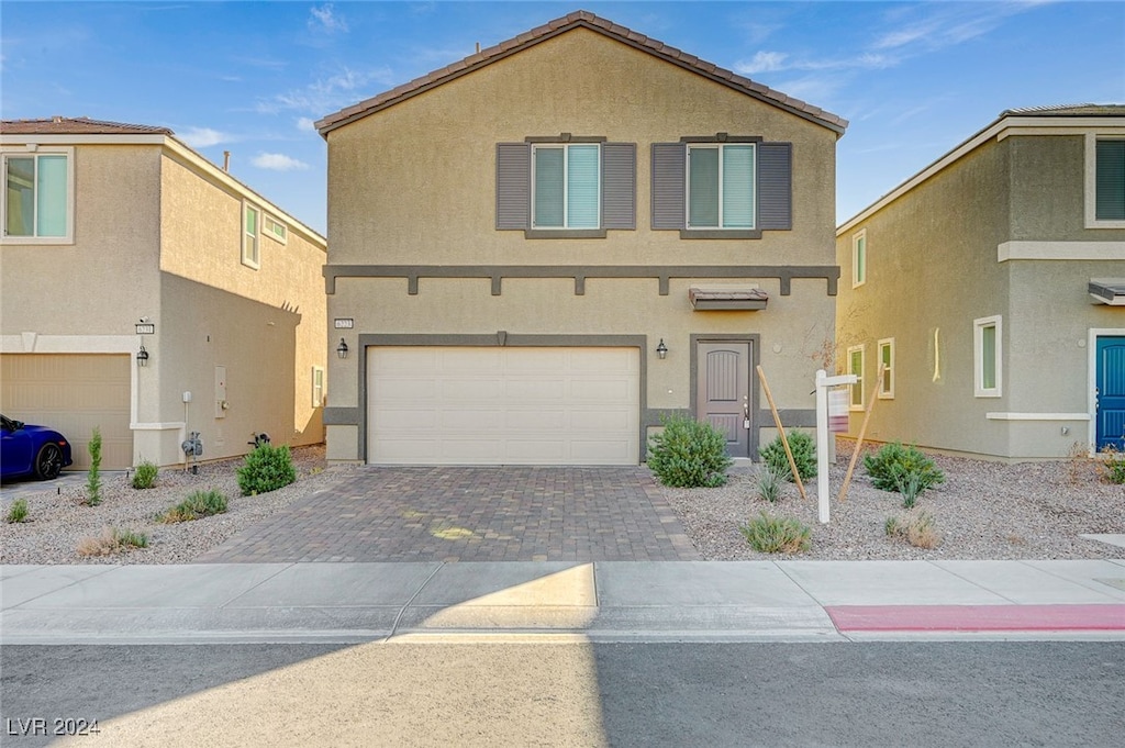 view of front of property with a garage