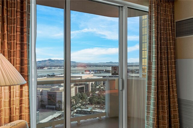 doorway featuring plenty of natural light and a water and mountain view