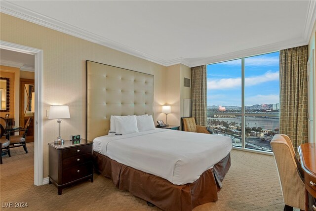 carpeted bedroom featuring access to outside, floor to ceiling windows, and ornamental molding