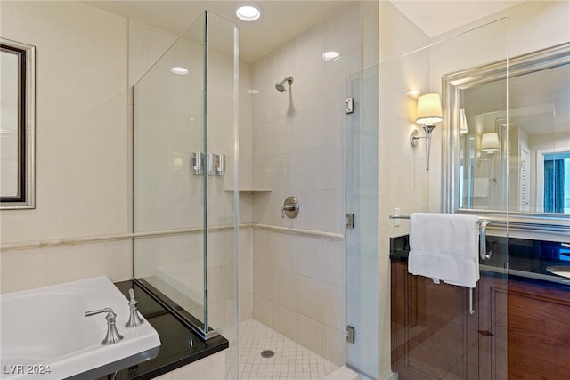 bathroom featuring shower with separate bathtub and vanity