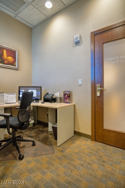 office with a paneled ceiling