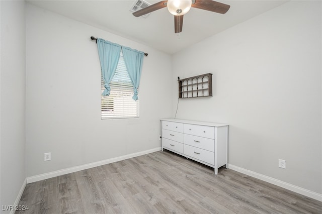 unfurnished room with ceiling fan and light wood-type flooring