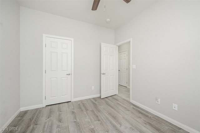 unfurnished bedroom with light hardwood / wood-style floors and ceiling fan