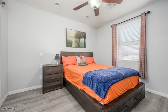 bedroom with ceiling fan and light hardwood / wood-style flooring