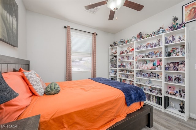 bedroom with ceiling fan and light wood-type flooring