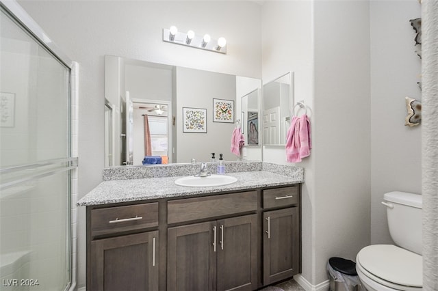 2675 Chinaberry Hill St, Laughlin, NV 89029 - bathroom with toilet, vanity, and a shower with door