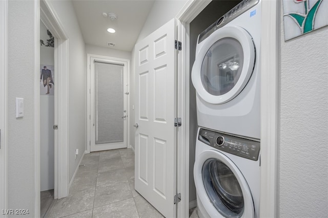 2675 Chinaberry Hill St, Laughlin, NV 89029 - laundry area featuring stacked washer / drying machine, baseboards, and recessed lighting