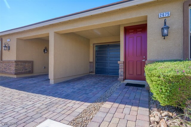 2675 Chinaberry Hill St, Laughlin, NV 89029 - entrance to property featuring stucco siding and a garage