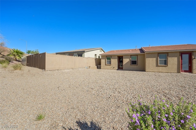 2675 Chinaberry Hill St, Laughlin, NV 89029 - rear view of house with fence and stucco siding