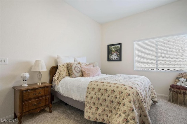 bedroom with light colored carpet